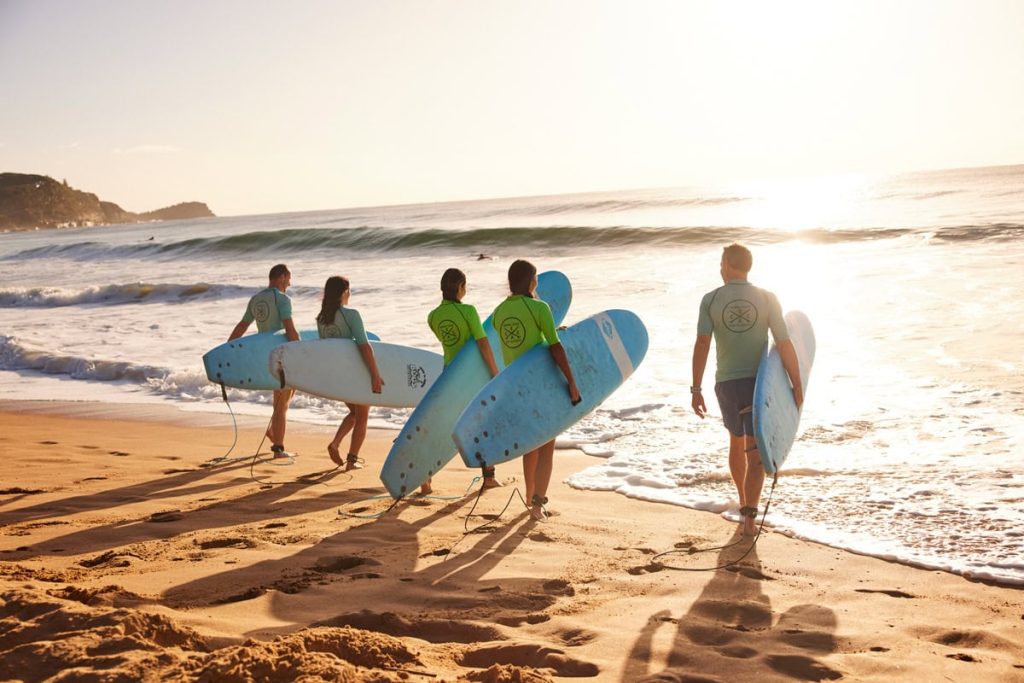 Students enjoying a learn to surf experience with Central Coast Surf Academy Avoca Beach Destrination NSW